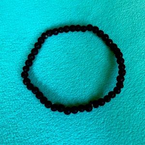 Black small lava rock bracelet made by me with stretchy cord